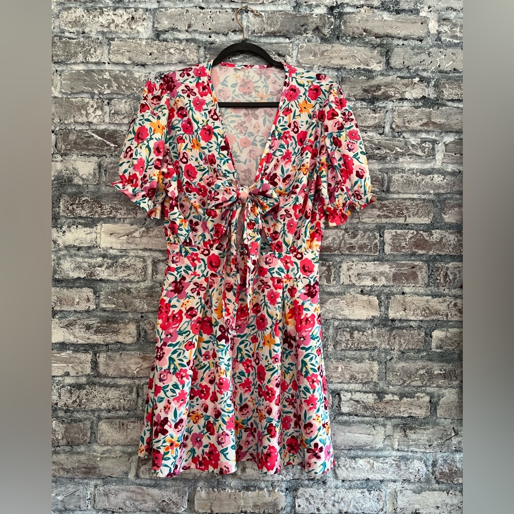 Beautiful vibrant color dress with tie cutout front. New never wore or washed